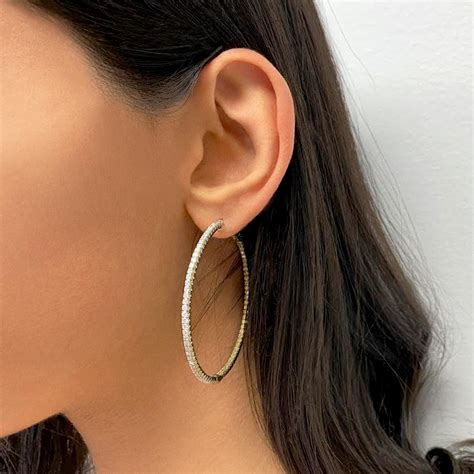 Designer Earrings: Fine Gold Hoops, Silver Studs.